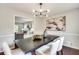 Stylish dining room with modern light fixture and view to the living area at 2242 Greencrest Ne Dr, Atlanta, GA 30345