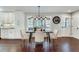 Dining area featuring modern lighting and large windows showcasing the outdoor view at 2242 Greencrest Ne Dr, Atlanta, GA 30345
