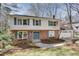 Charming two-story home featuring brick and siding with blue shutters and a manicured front yard at 2242 Greencrest Ne Dr, Atlanta, GA 30345