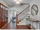 Foyer with hardwood floors, staircase, console table, and decorative accents at 2242 Greencrest Ne Dr, Atlanta, GA 30345