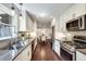 Galley kitchen with modern appliances, ample counter space, and a dining area in view at 2242 Greencrest Ne Dr, Atlanta, GA 30345
