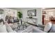 Open living room with stylish furniture, hardwood floors, modern decor, and an open view to dining room at 2242 Greencrest Ne Dr, Atlanta, GA 30345