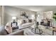 Cozy living room with comfortable seating, area rug, tasteful decor, and an open view to dining room at 2242 Greencrest Ne Dr, Atlanta, GA 30345