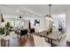 Bright open-concept living and dining area with hardwood floors and modern decor at 2242 Greencrest Ne Dr, Atlanta, GA 30345