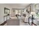 Inviting living room with neutral tones, plush seating, area rug and plenty of natural light at 2242 Greencrest Ne Dr, Atlanta, GA 30345