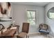 Home office space with wood desk, chair, and window view at 2242 Greencrest Ne Dr, Atlanta, GA 30345