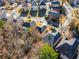 Aerial view of a neighborhood featuring lush trees, sidewalks, and well maintained front lawns at 2591 Royston Dr, Duluth, GA 30097
