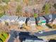 Aerial view of a suburban street with sidewalks and well-manicured lawns at 2591 Royston Dr, Duluth, GA 30097