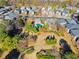 Community pool and playground surrounded by homes and lush trees at 2591 Royston Dr, Duluth, GA 30097