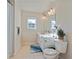 Bright bathroom with a white vanity, tile flooring, and a large mirror at 2591 Royston Dr, Duluth, GA 30097