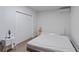 Minimalist bedroom with a white color scheme, built in closet and hardwood floors at 2591 Royston Dr, Duluth, GA 30097