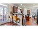 Modern kitchen with granite countertops, stainless steel appliances, and a breakfast bar at 2591 Royston Dr, Duluth, GA 30097