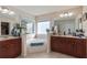 Bathroom with a large soaking tub between and sinks and vanities at 2591 Royston Dr, Duluth, GA 30097