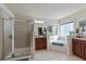 Spacious main bathroom featuring a separate shower, large tub, and dual vanity sinks at 2591 Royston Dr, Duluth, GA 30097
