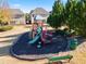A colorful playground with slides, benches, and a safety-conscious surface in a community green space at 2591 Royston Dr, Duluth, GA 30097