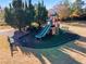 A colorful playground with slides, benches, and a soft landing surface at 2591 Royston Dr, Duluth, GA 30097