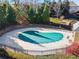 Community pool surrounded by mature trees and landscaping offering a serene and private recreational space at 2591 Royston Dr, Duluth, GA 30097