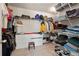 Walk-in closet featuring ample shelving, clothing racks, and carpeted flooring at 2591 Royston Dr, Duluth, GA 30097