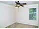 Bedroom with neutral walls, plush carpet, a window, and a ceiling fan with light at 3356 Sardis Bend Dr, Buford, GA 30519