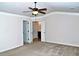 Relax in this spacious bedroom with neutral walls, plush carpets, a ceiling fan, and easy access to the bathroom at 3356 Sardis Bend Dr, Buford, GA 30519