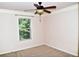 Bedroom with neutral walls, plush carpet, a window, and a ceiling fan with light at 3356 Sardis Bend Dr, Buford, GA 30519