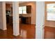 Eat in kitchen with black appliances, granite counters, tile backsplash, and hardwood floors at 3356 Sardis Bend Dr, Buford, GA 30519