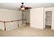 Relax in this bright living room, complete with plush carpets, neutral paint, and a staircase leading to the lower level at 3356 Sardis Bend Dr, Buford, GA 30519
