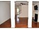Open-concept living room featuring hardwood floors, fireplace, and a staircase with white railings at 3356 Sardis Bend Dr, Buford, GA 30519