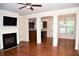 Spacious living room boasts hardwood floors, a fireplace, and decorative columns at 3356 Sardis Bend Dr, Buford, GA 30519