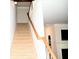 Carpeted staircase with wooden railings leading to the upper level at 3356 Sardis Bend Dr, Buford, GA 30519