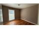 Cozy bedroom with hardwood floors and natural light, a comfortable space for relaxation and rest at 781 E Glochester Pl, Norcross, GA 30071