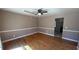 Inviting living room with hardwood floors and classic trim, offering a cozy atmosphere for Gathering gatherings at 781 E Glochester Pl, Norcross, GA 30071