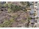 Aerial view of a wooded property with houses along a tree-lined street, offering a serene neighborhood setting at 1463 Bailey Farm Sw Dr, Marietta, GA 30064