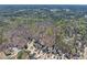 Expansive aerial view of a wooded property surrounded by homes in a quiet residential neighborhood at 1463 Bailey Farm Sw Dr, Marietta, GA 30064