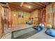 Unfinished basement gym featuring a rubber floor, exercise equipment, and exposed beams at 1463 Bailey Farm Sw Dr, Marietta, GA 30064