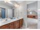Bathroom featuring a double sink wooden vanity with a white countertop, a shower, and a toilet at 1463 Bailey Farm Sw Dr, Marietta, GA 30064