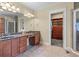 Primary bathroom featuring double sinks, tile floor, and walk-in closet at 1463 Bailey Farm Sw Dr, Marietta, GA 30064