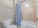 Bright bathroom featuring a tub and shower combo with stylish blue shower curtain at 1463 Bailey Farm Sw Dr, Marietta, GA 30064