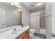 Bathroom featuring a wooden vanity with a white sink top and a shower and tub combo at 1463 Bailey Farm Sw Dr, Marietta, GA 30064