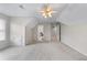 Spacious bonus room featuring a ceiling fan, bright windows, and multiple entryways at 1463 Bailey Farm Sw Dr, Marietta, GA 30064
