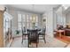 Bright breakfast nook with a round table, shutters, and access to a patio at 1463 Bailey Farm Sw Dr, Marietta, GA 30064