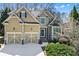 Inviting two-story home with a well-manicured lawn, a two car garage, and stone and siding accents at 1463 Bailey Farm Sw Dr, Marietta, GA 30064