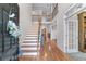 Welcoming foyer with hardwood floors, a staircase, and an open view to the upper level at 1463 Bailey Farm Sw Dr, Marietta, GA 30064