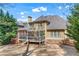 View of rear exterior showing the deck, porch, and expansive back yard at 1463 Bailey Farm Sw Dr, Marietta, GA 30064