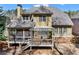 Aerial view of rear exterior showing the deck, porch, and expansive back yard at 1463 Bailey Farm Sw Dr, Marietta, GA 30064