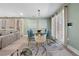 Elegant dining area with a glass-top table, modern chairs, and stylish decor, perfect for entertaining at 2047 Boulderview Se Dr, Atlanta, GA 30316