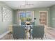 Dining room showcasing a glass table set, modern lighting, and stylish wall decor for an elegant dining experience at 2047 Boulderview Se Dr, Atlanta, GA 30316