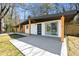 Low angle view of the home showcasing a modern exterior, with a large patio area for outdoor enjoyment at 2047 Boulderview Se Dr, Atlanta, GA 30316