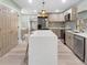 Modern kitchen with white quartz countertops, stainless steel appliances, and ample storage at 2047 Boulderview Se Dr, Atlanta, GA 30316