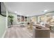 Bright living room with large windows, a cozy seating area, and a dedicated workspace at 2047 Boulderview Se Dr, Atlanta, GA 30316